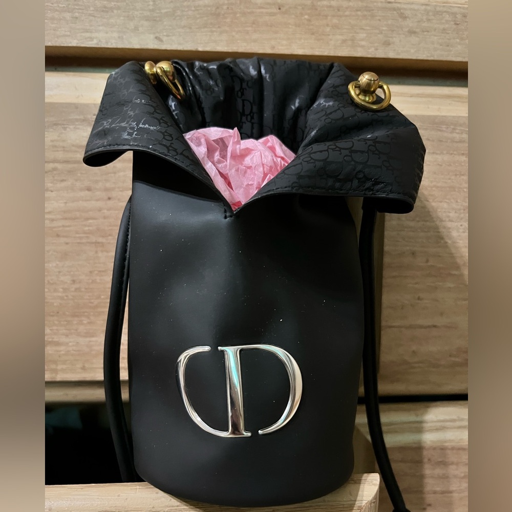 Dior Brush bag turned into crossbody with D rings.